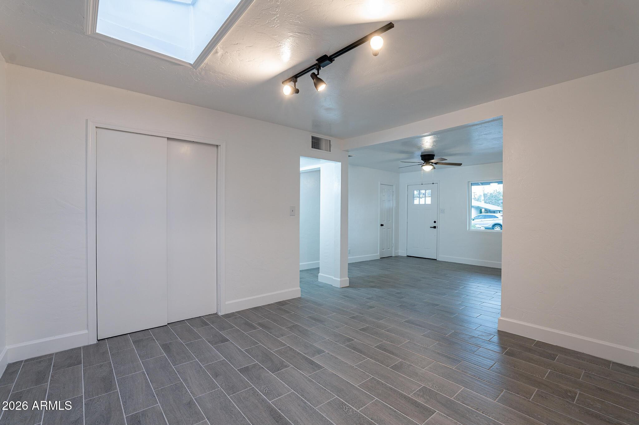 536 West 18th Street Tempe, AZ 85281 - Photo 19 of 39 an empty room with wooden floor and a ceiling fan