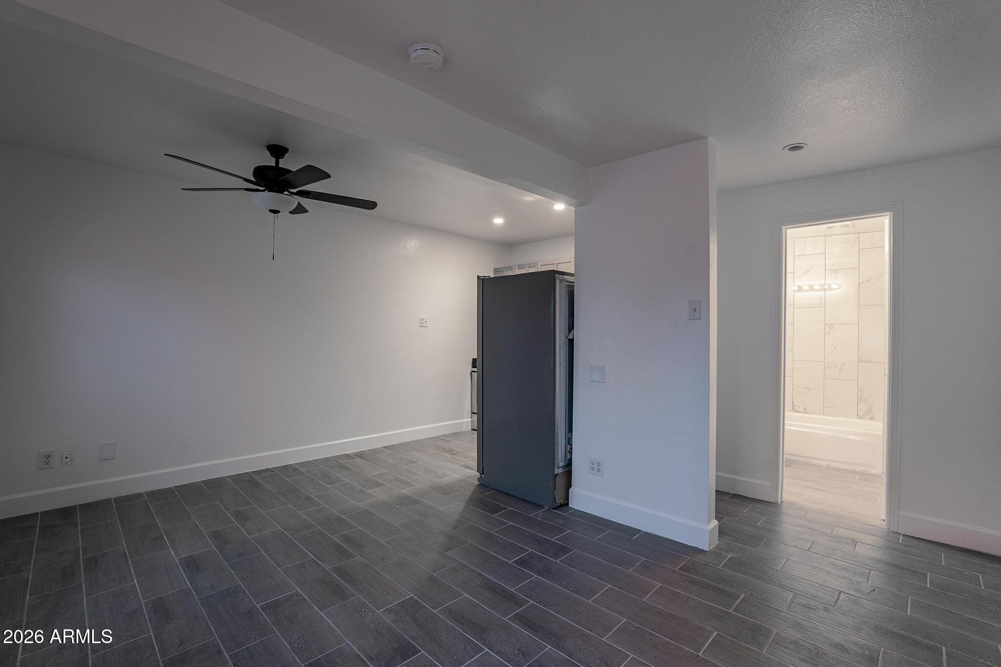 536 West 18th Street Tempe, AZ 85281 - Photo 27 of 39 an empty room with wooden floor and a ceiling fan