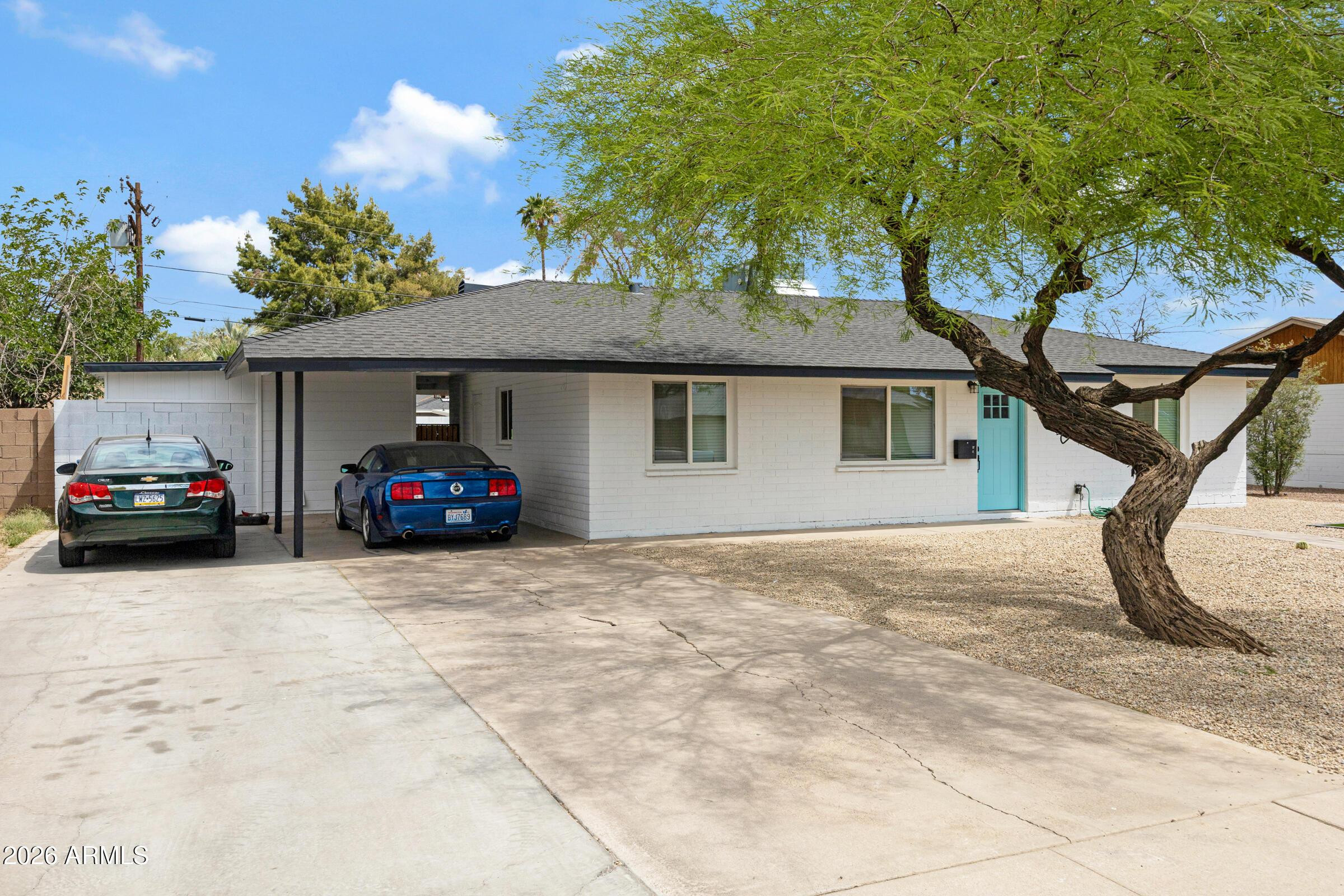 536 West 18th Street Tempe, AZ 85281 - Photo 3 of 39 a view of a car parked in front of a house