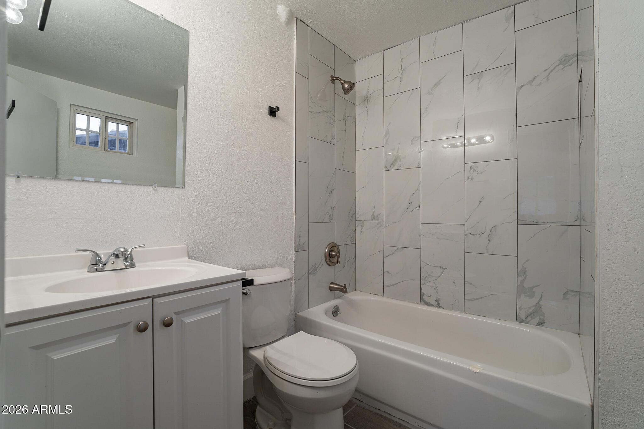 536 West 18th Street Tempe, AZ 85281 - Photo 38 of 39 a bathroom with a sink toilet and shower