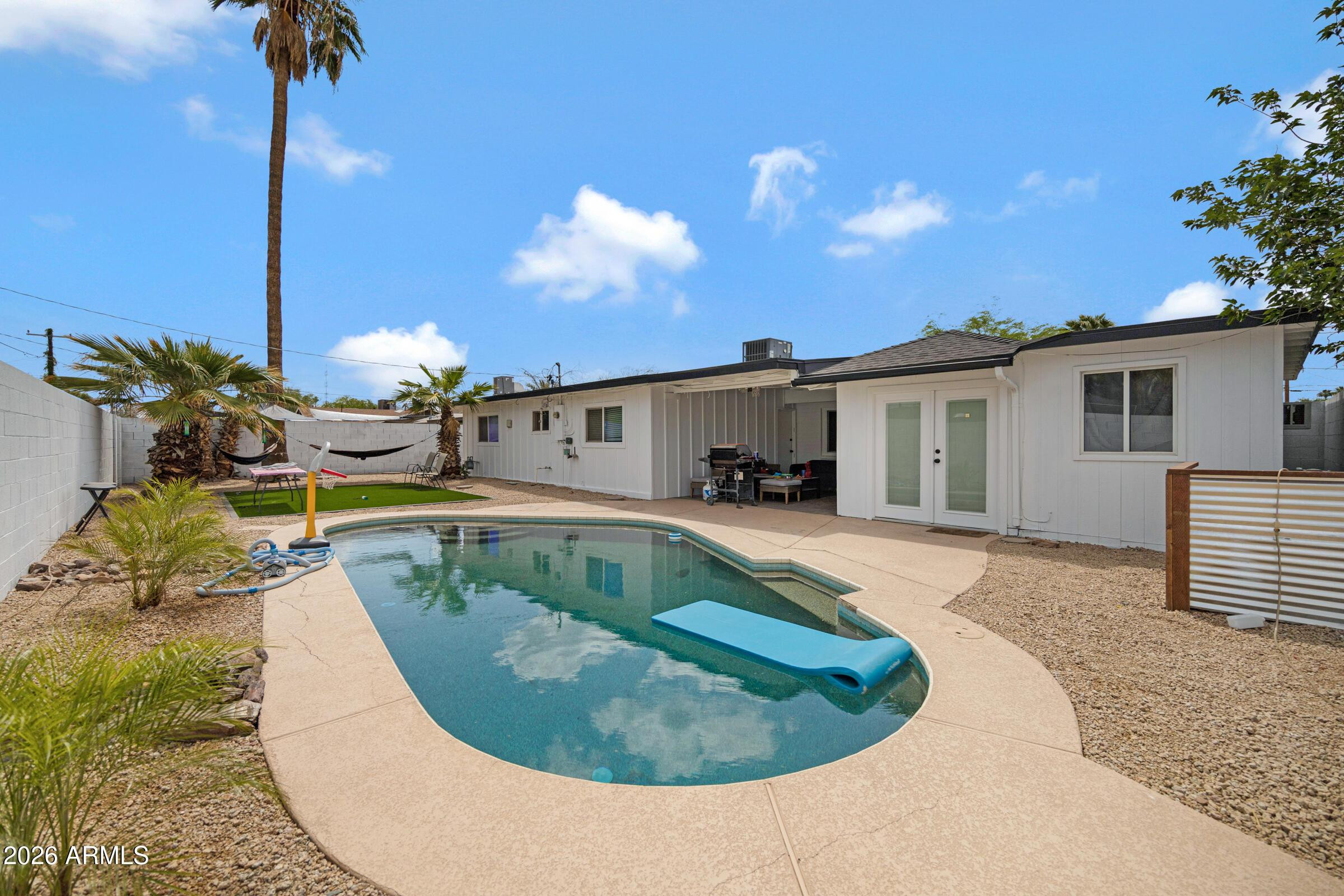 536 West 18th Street Tempe, AZ 85281 - Photo 6 of 39 a view of a house with swimming pool