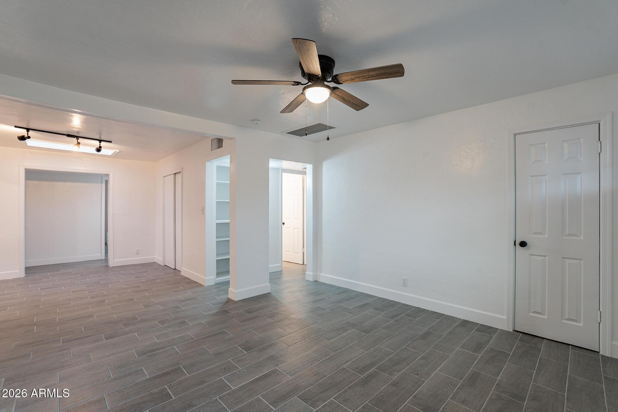 536 West 18th Street Tempe, AZ 85281 - Photo 10 of 39 a view of empty room with wooden floor