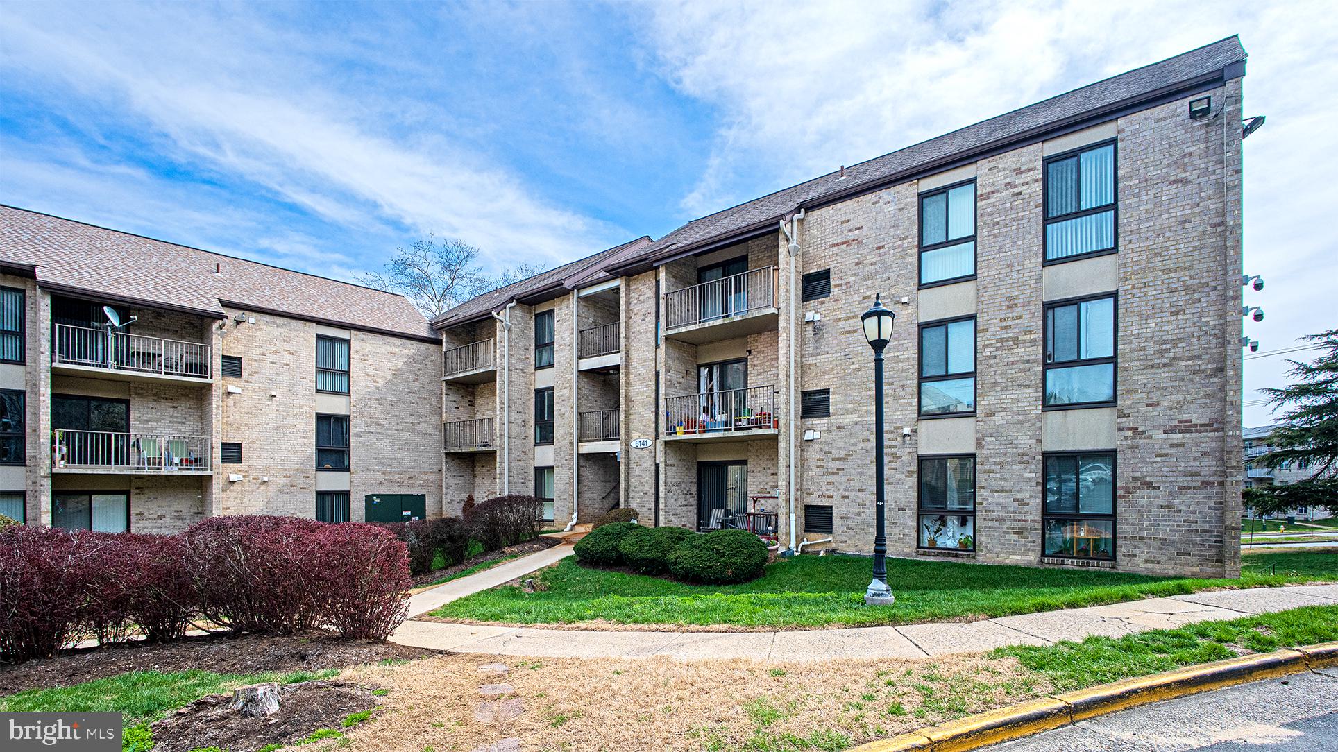 6141 Edsall Road, Unit B Alexandria, VA 22304 - Photo 20 of 27 a front view of a building with a garden and plants