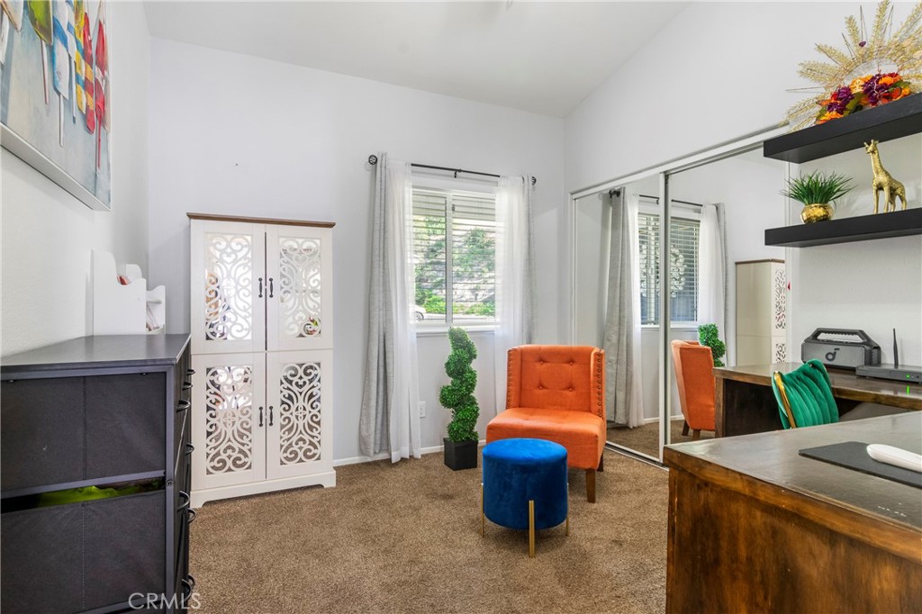 16366 West Sun Canyon Street Riverside, CA 92503 - Photo 14 of 21 a living room with furniture a rug and a window