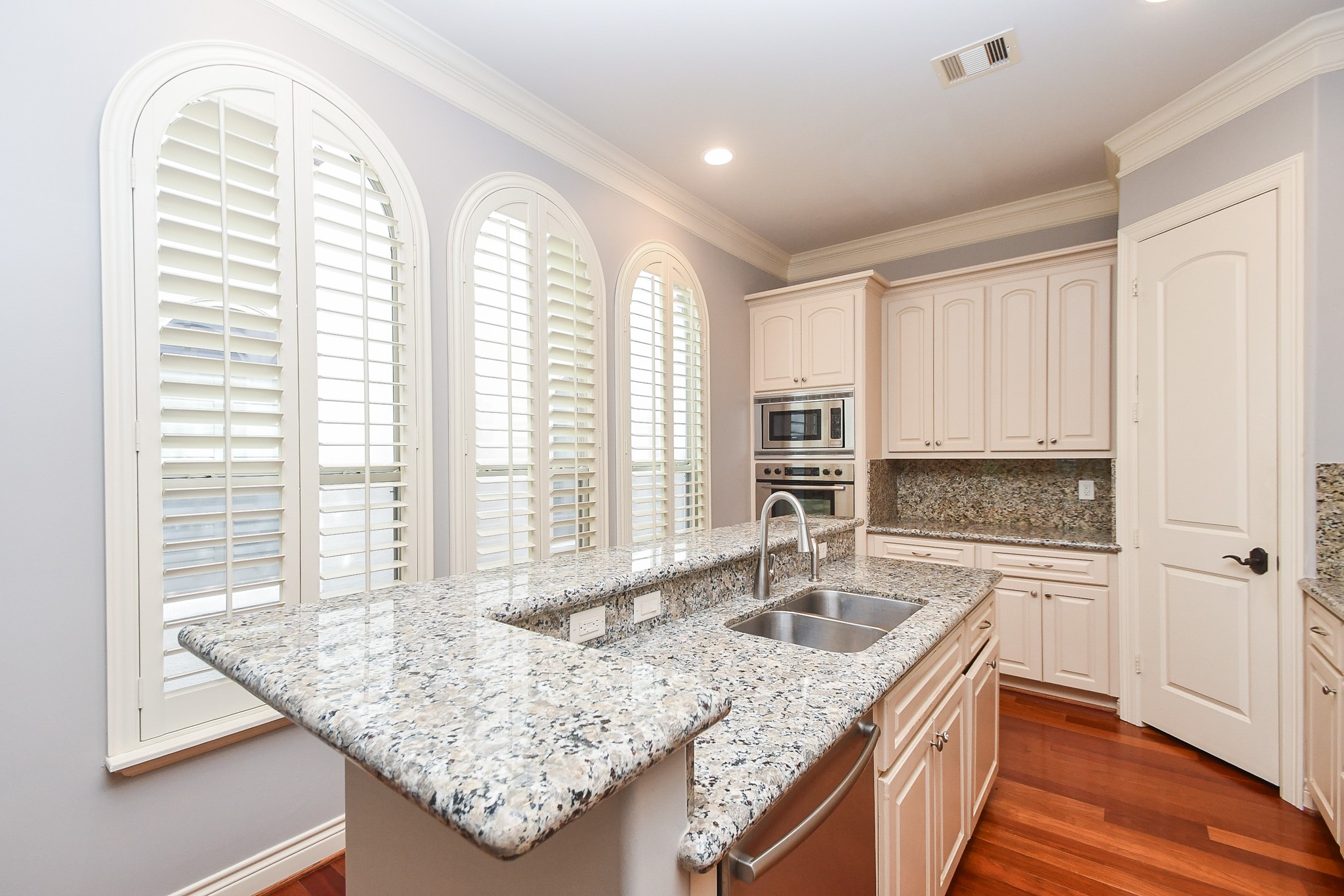 717 Welch Street Houston, TX 77006 - Photo 13 of 32 a kitchen with a sink stove and cabinets