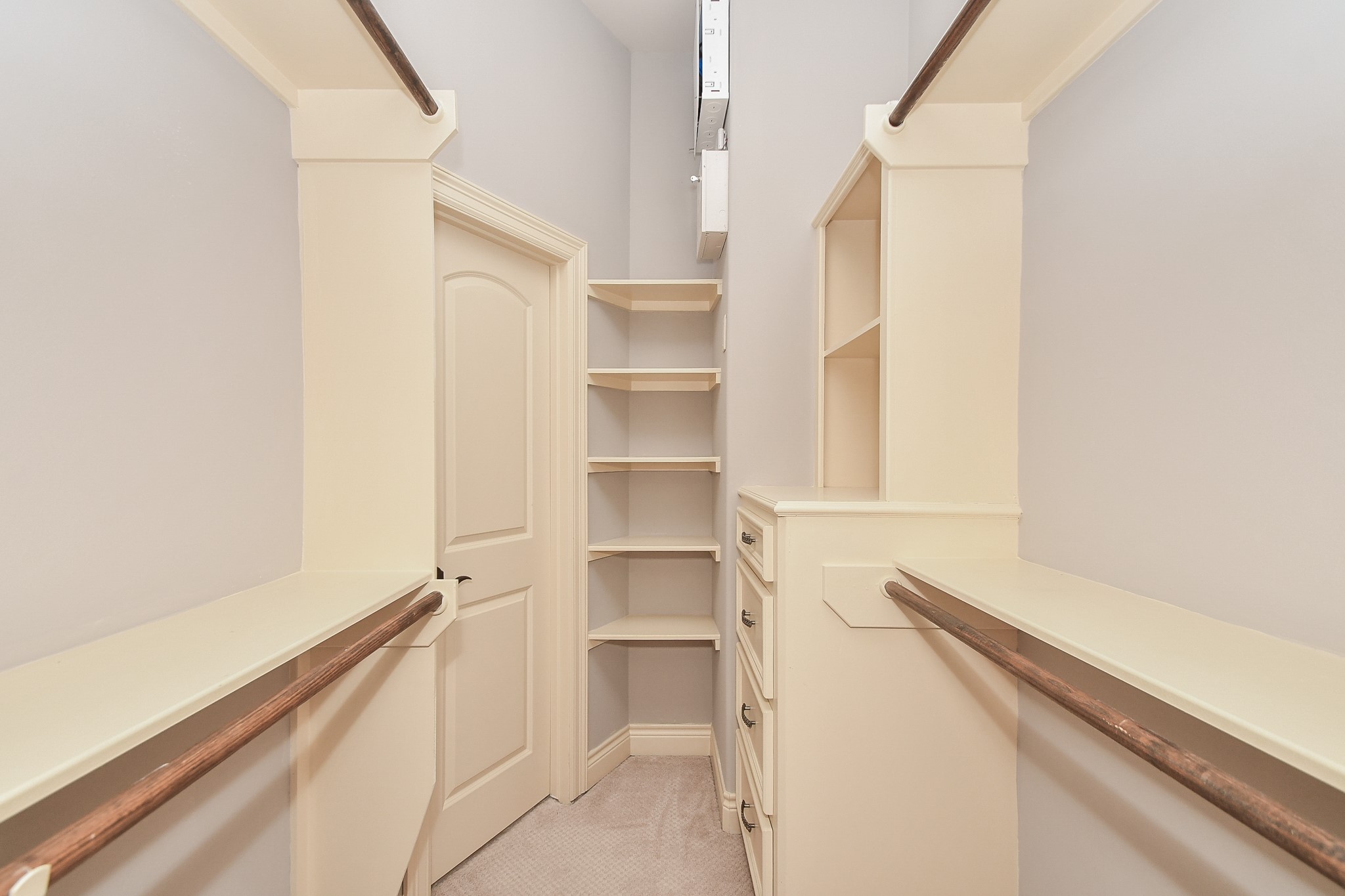 717 Welch Street Houston, TX 77006 - Photo 24 of 32 a view of walk in closet with empty racks