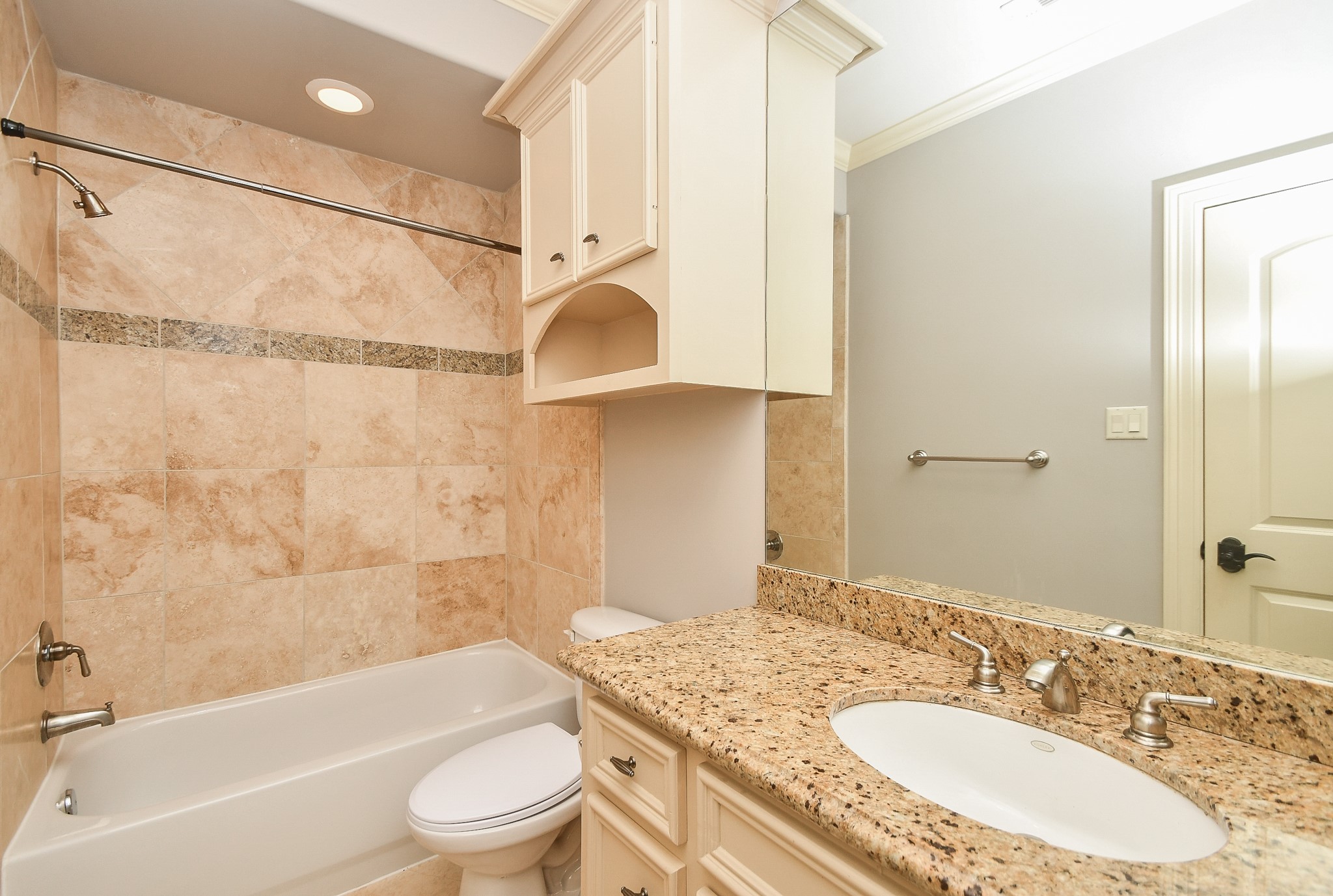 717 Welch Street Houston, TX 77006 - Photo 30 of 32 a bathroom with a granite countertop sink toilet and shower