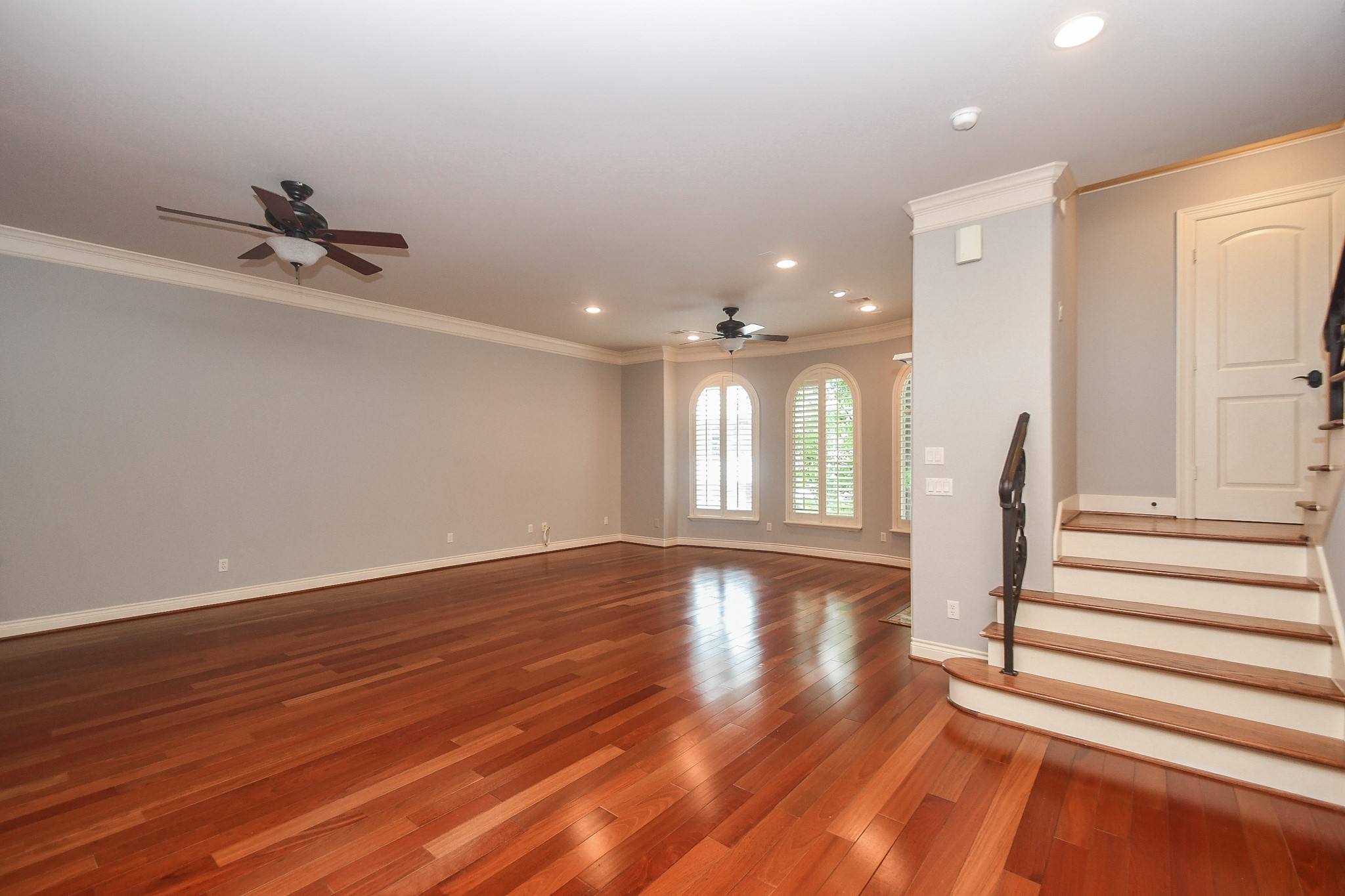 717 Welch Street Houston, TX 77006 - Photo 6 of 32 a view of an empty room with wooden floor and a window