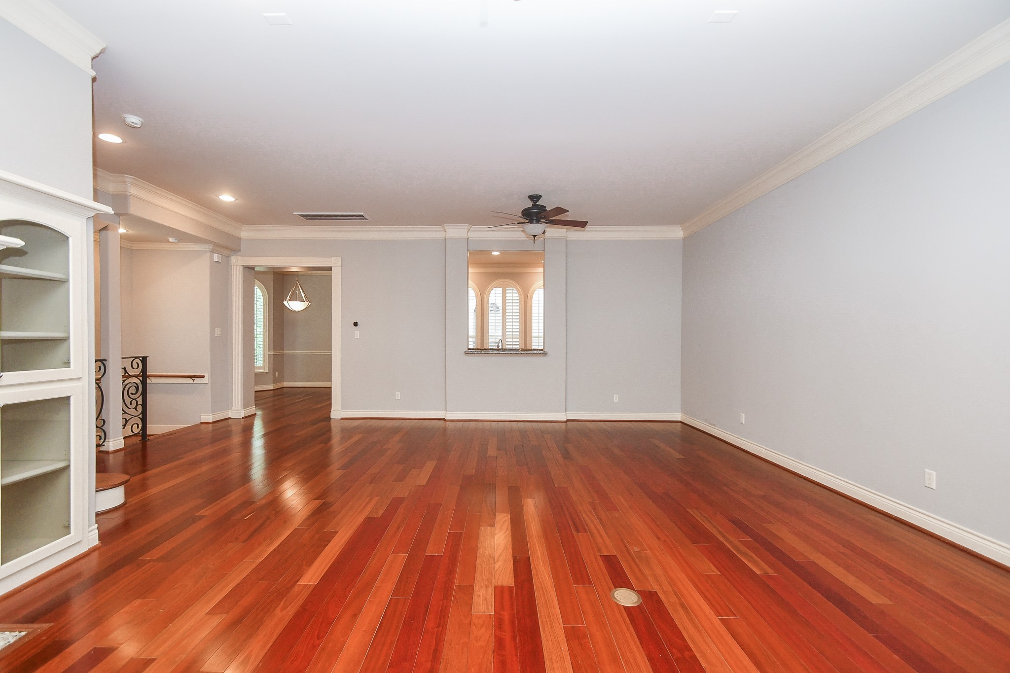 717 Welch Street Houston, TX 77006 - Photo 9 of 32 wooden floor in an empty room with a window