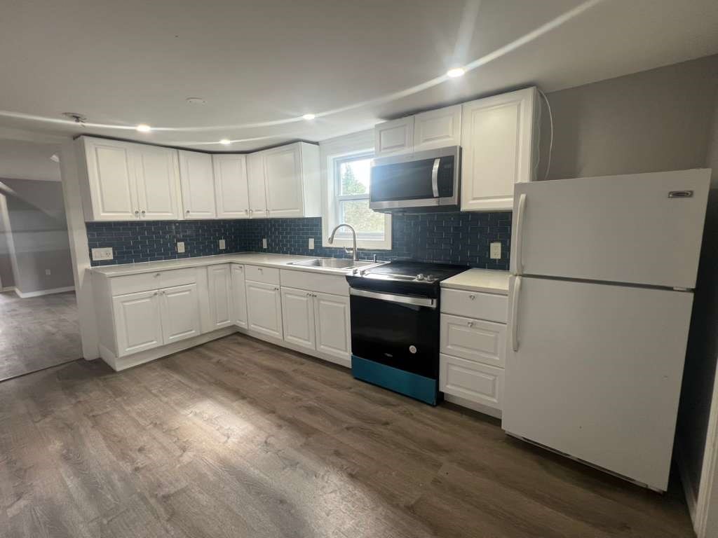 2 Oliver Street, Unit 3 Southbridge, MA 01550 - Photo 1 of 7 a kitchen with a refrigerator sink and cabinets