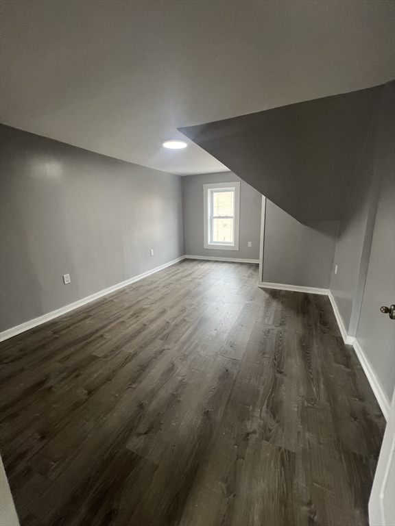 2 Oliver Street, Unit 3 Southbridge, MA 01550 - Photo 6 of 7 an empty room with wooden floor and windows