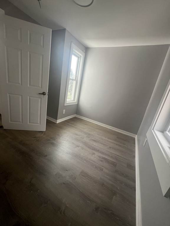 2 Oliver Street, Unit 3 Southbridge, MA 01550 - Photo 7 of 7 a view of an empty room with wooden floor and a window