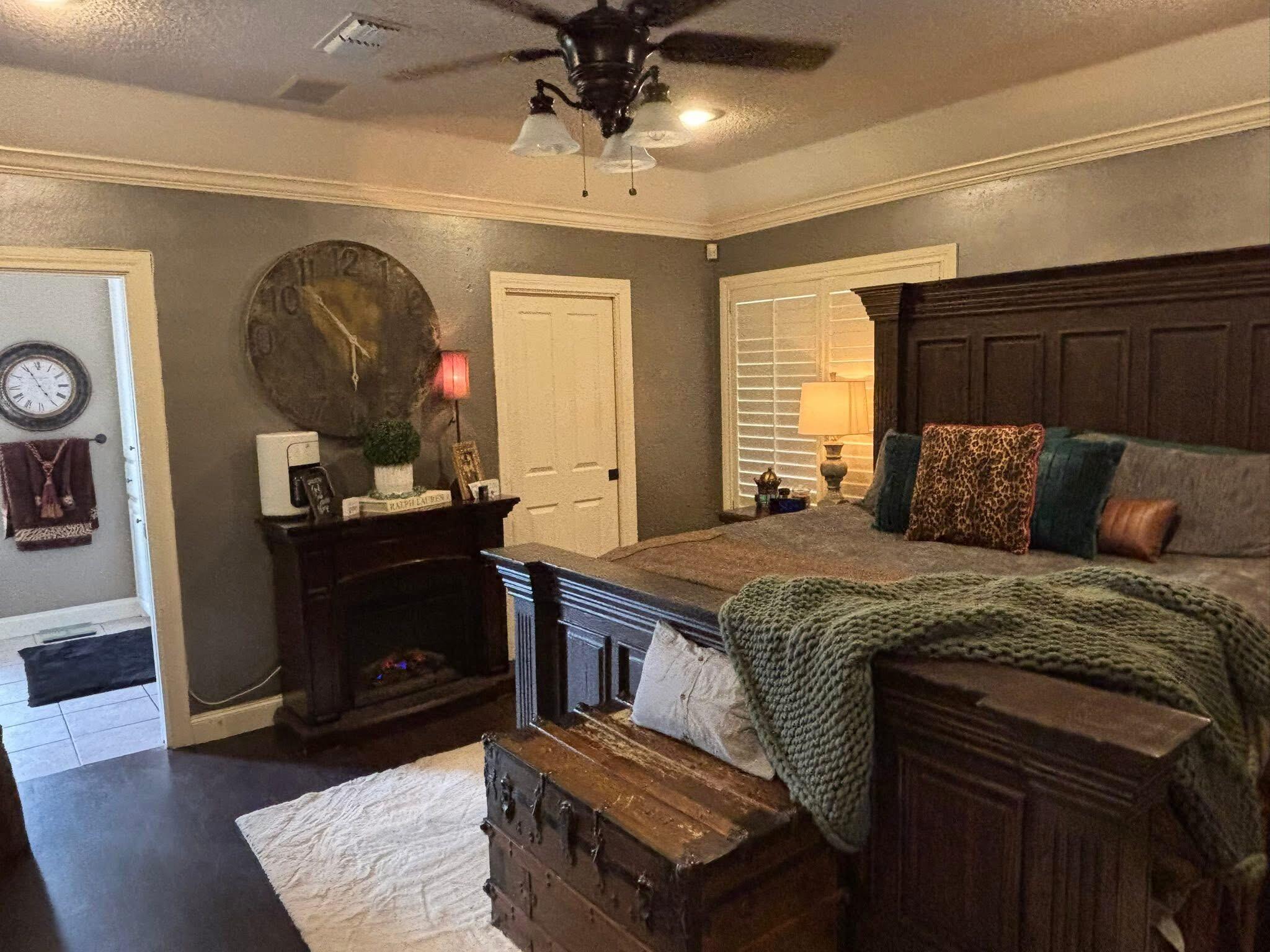 1402 9th Street Shallowater, TX 79363 - Photo 13 of 49 a bedroom with a bed and a dresser