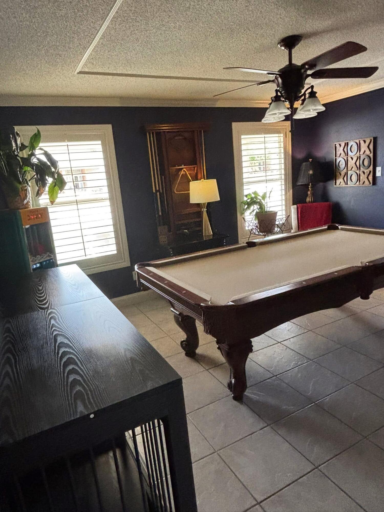 1402 9th Street Shallowater, TX 79363 - Photo 18 of 49 a room with pool table and windows