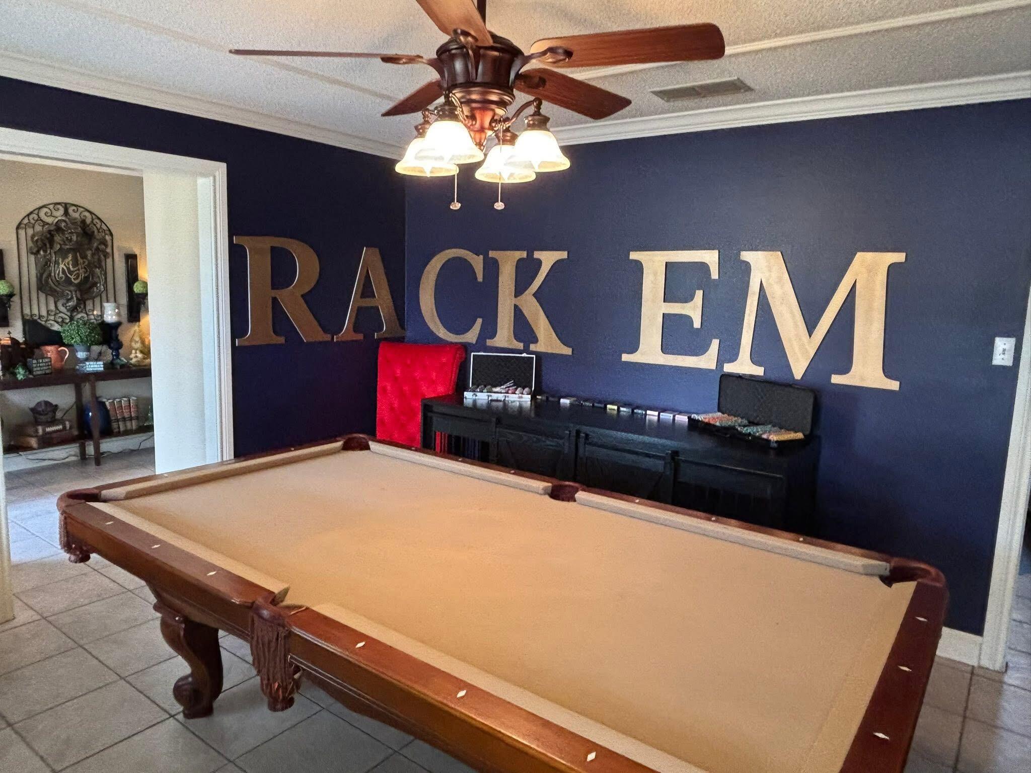 1402 9th Street Shallowater, TX 79363 - Photo 19 of 49 a room with pool table and wall paintings