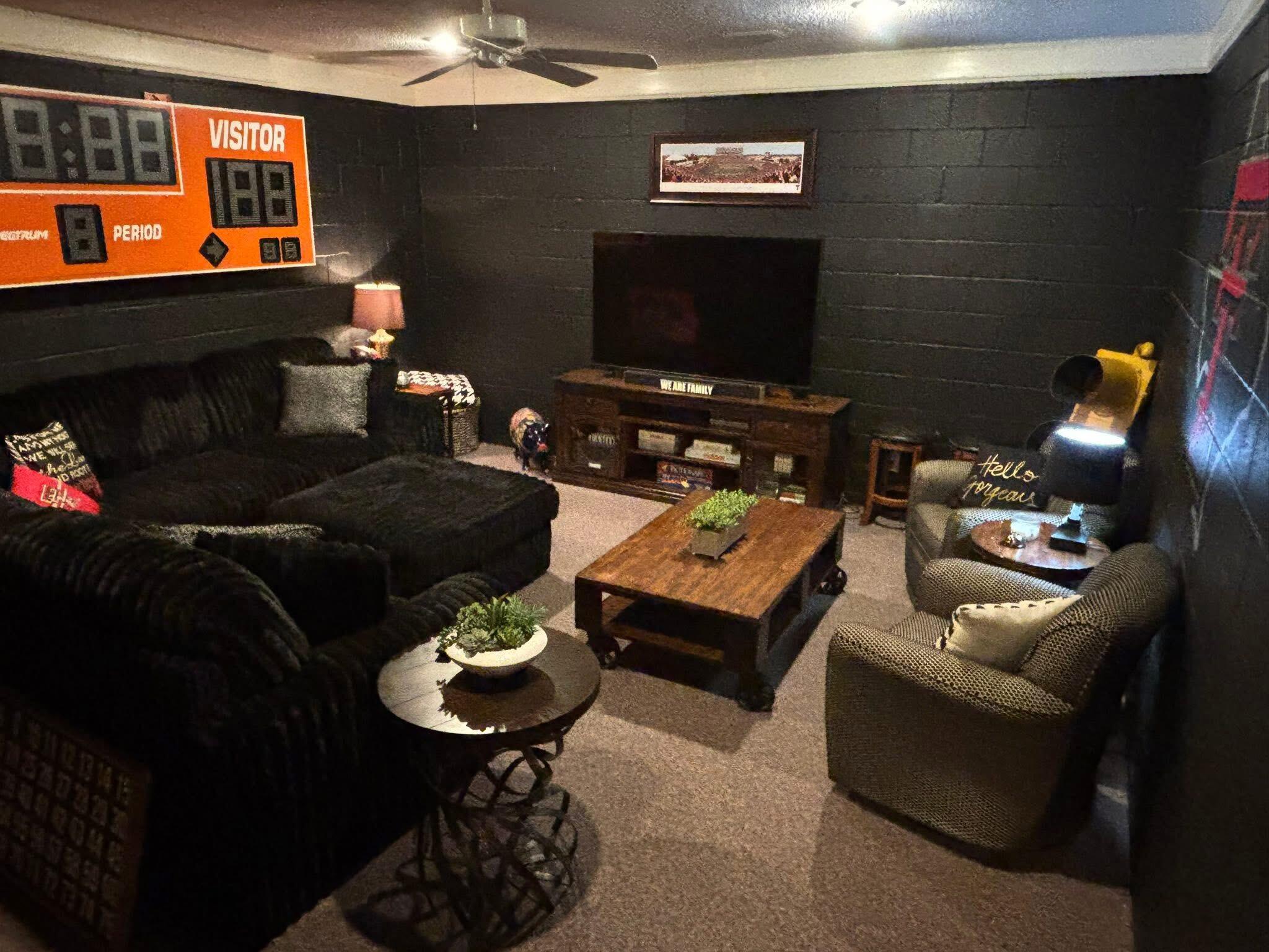 1402 9th Street Shallowater, TX 79363 - Photo 21 of 49 a living room with furniture and a flat screen tv