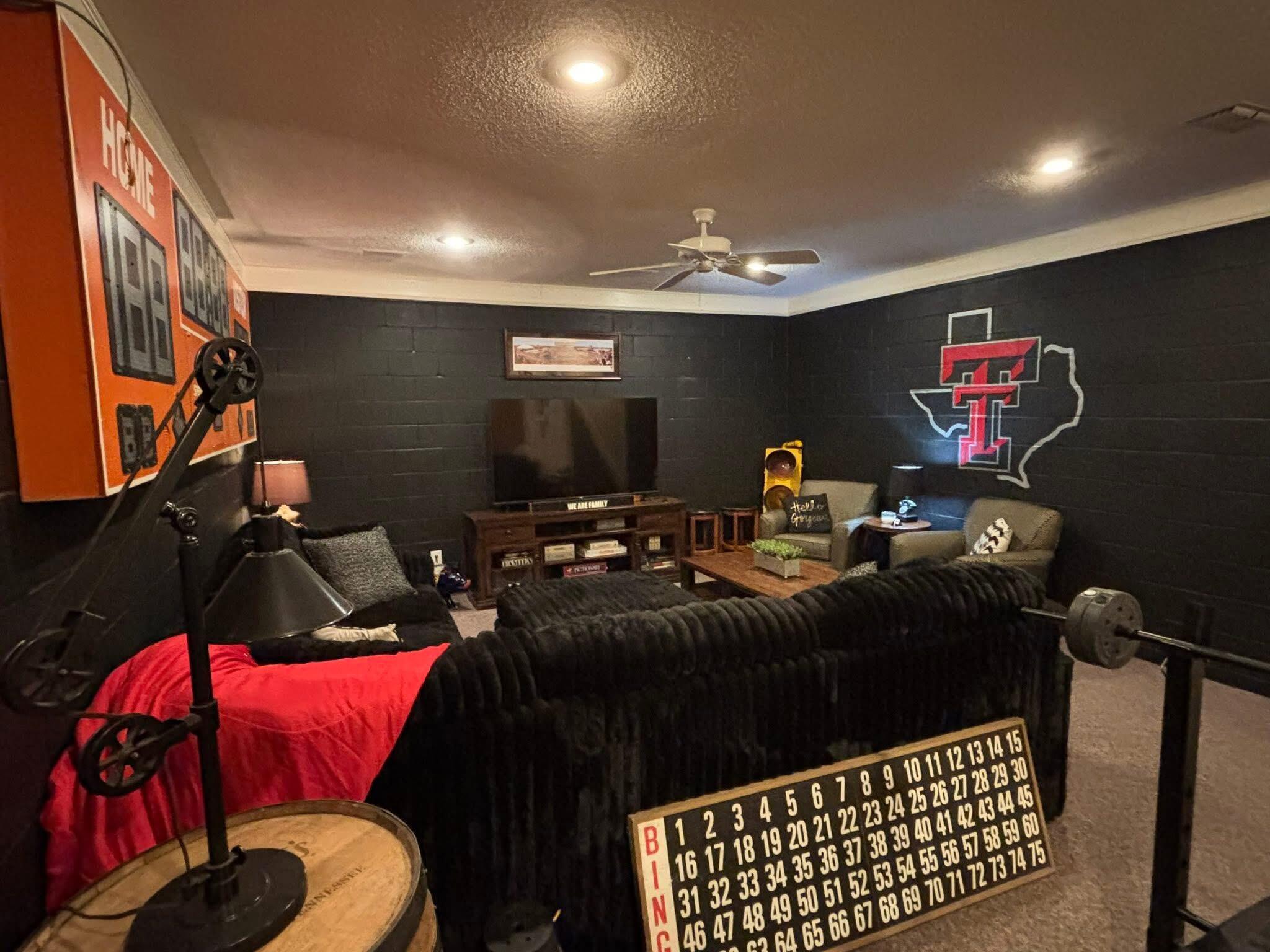 1402 9th Street Shallowater, TX 79363 - Photo 23 of 49 a bed room with a bed and a couch