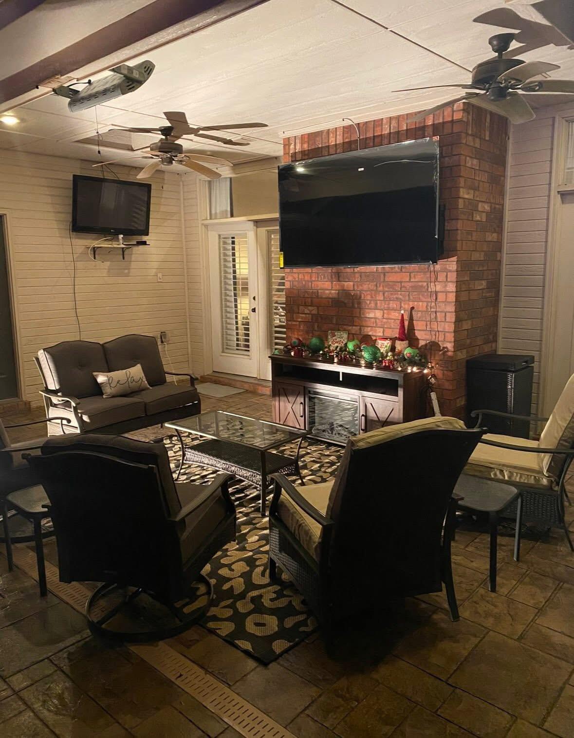 1402 9th Street Shallowater, TX 79363 - Photo 37 of 49 a living room with furniture and a flat screen tv