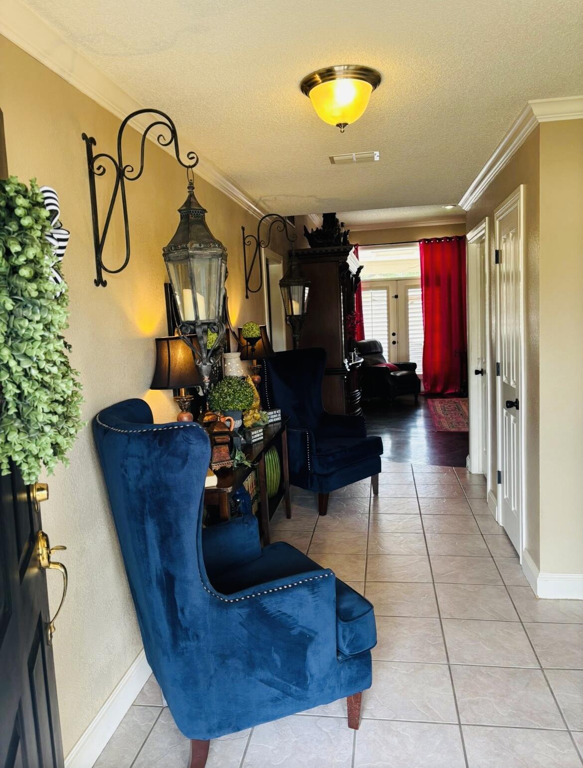 1402 9th Street Shallowater, TX 79363 - Photo 5 of 49 a living room with furniture flowers and a chandelier