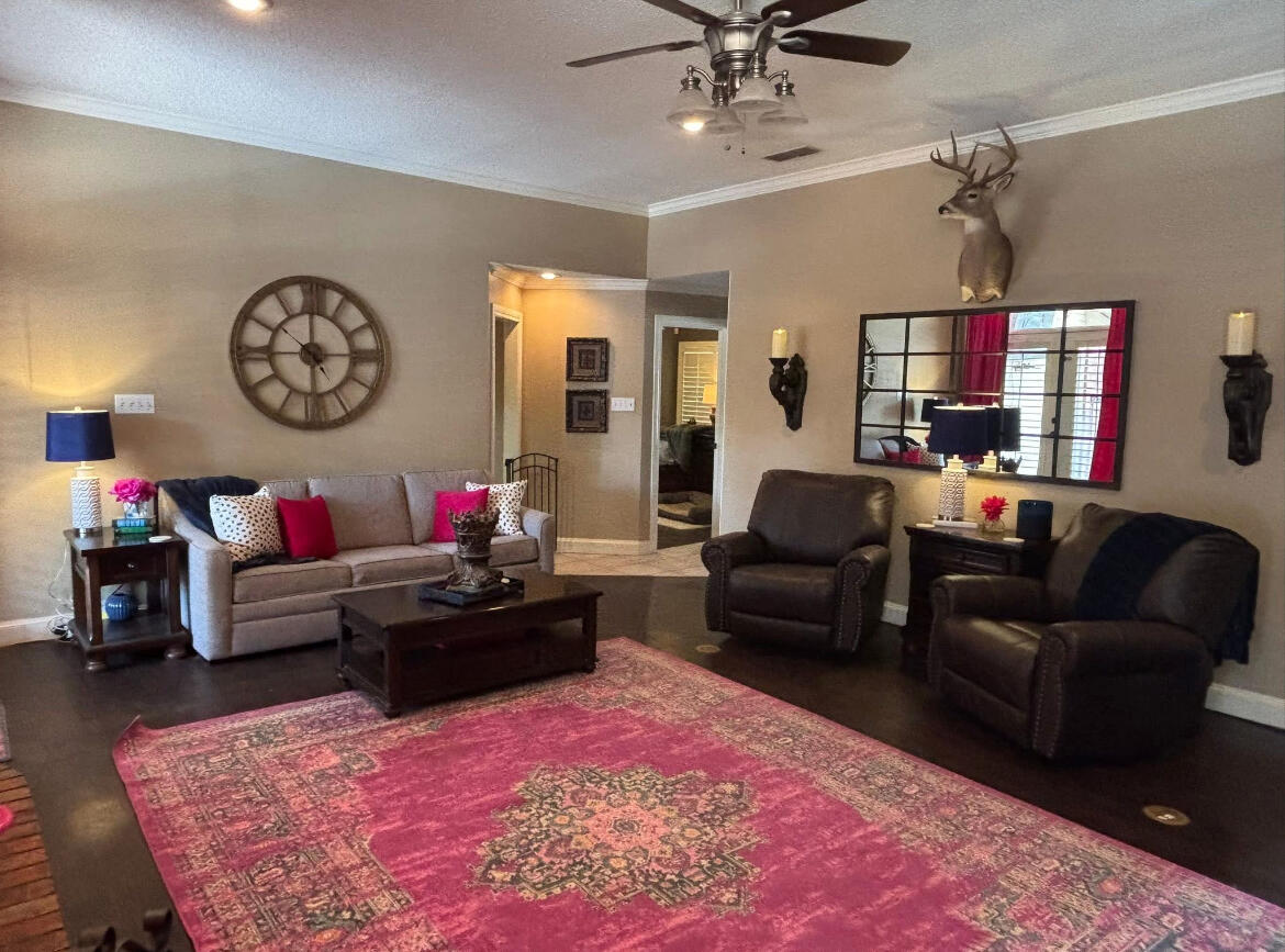 1402 9th Street Shallowater, TX 79363 - Photo 7 of 49 a living room with furniture and a large window