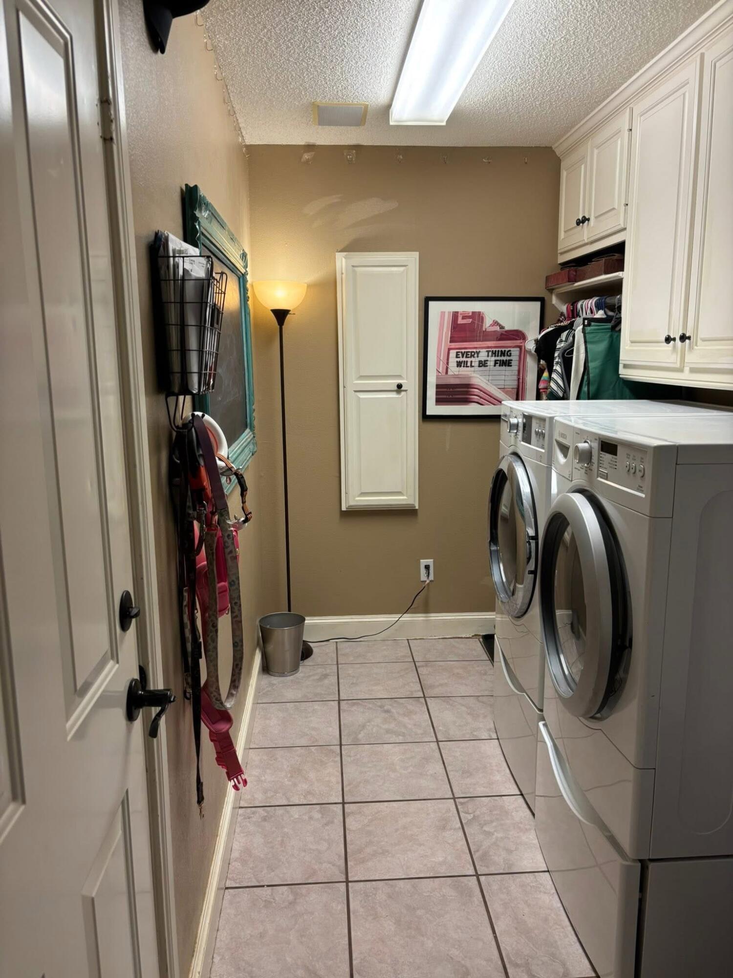 1402 9th Street Shallowater, TX 79363 - Photo 10 of 49 a view of a storage & utility room with washer and dryer
