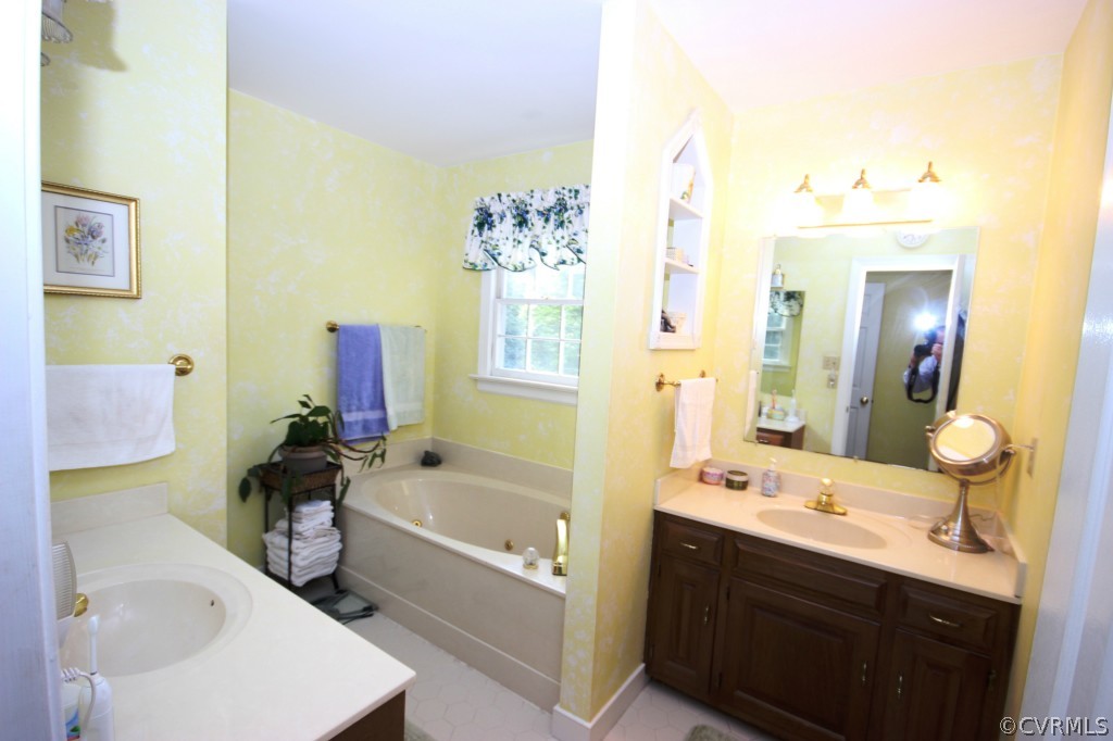 5200 Copperpenny Road Chesterfield, VA 23832 - Photo 14 of 24 a bathroom with a tub sink and mirror