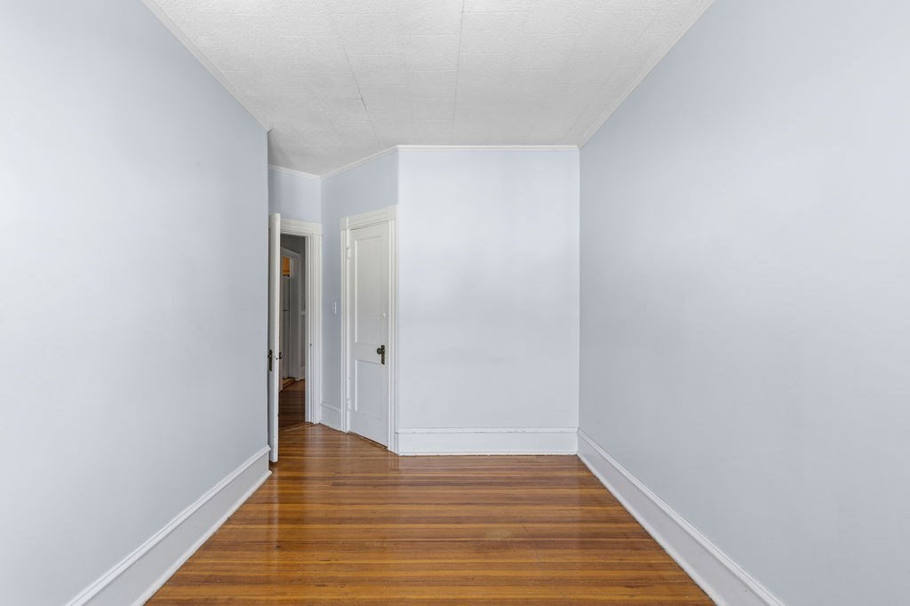138 South Main Street, Unit 13 Fairhaven, MA 02719 - Photo 15 of 31 a view of an empty room with wooden floor