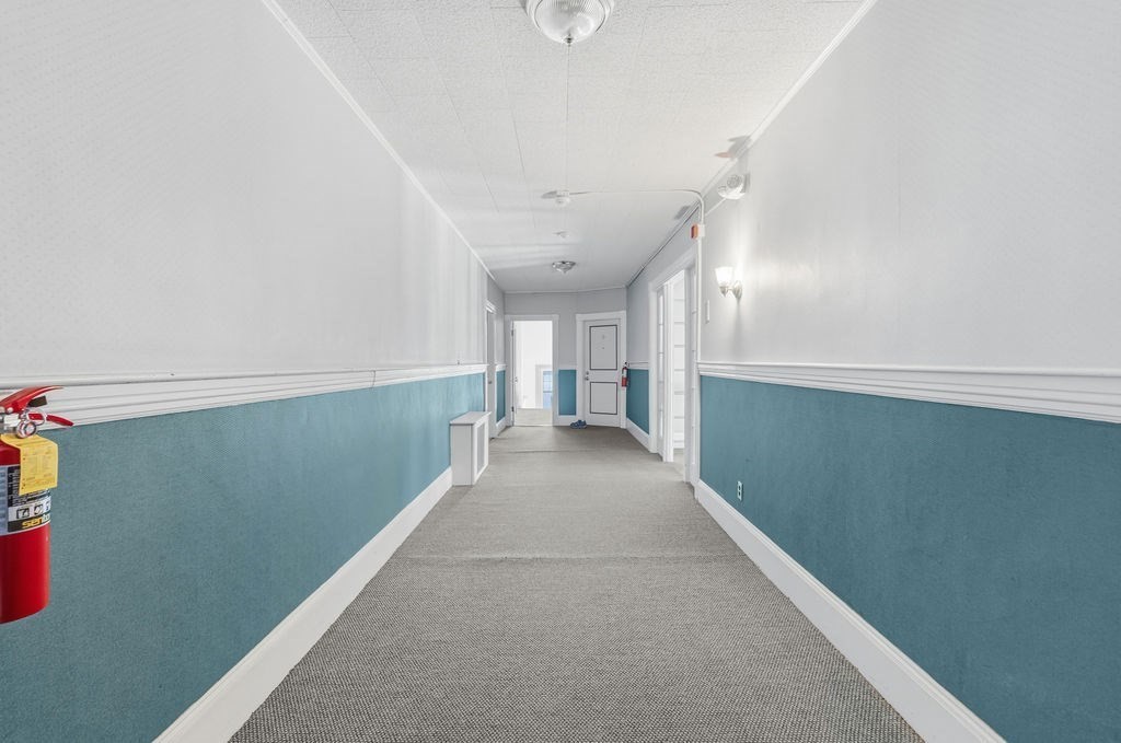 138 South Main Street, Unit 13 Fairhaven, MA 02719 - Photo 18 of 31 a view of a hallway with closet