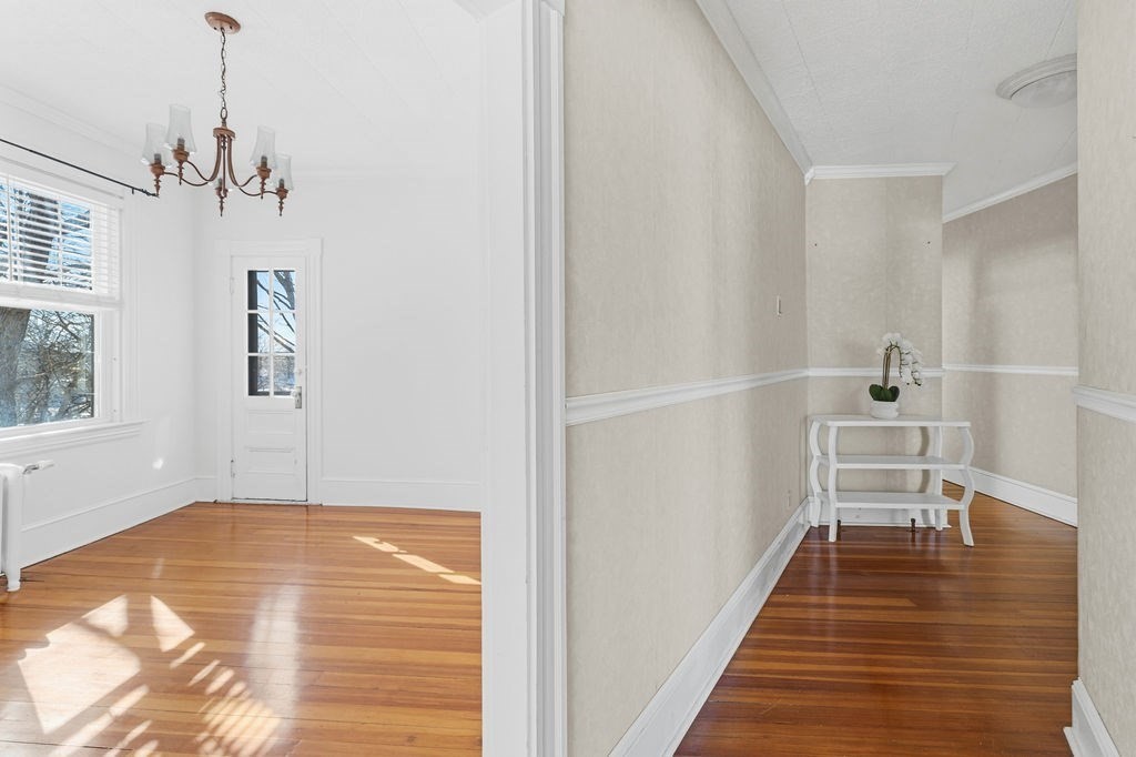 138 South Main Street, Unit 13 Fairhaven, MA 02719 - Photo 7 of 31 a view of a livingroom with wooden floor and a ceiling fan