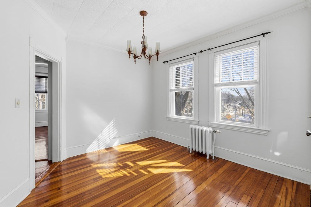 138 South Main Street, Unit 13 Fairhaven, MA 02719 - Photo 8 of 31 a view of empty room with wooden floor and fan