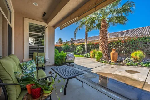 a view of a chairs and table in the patio