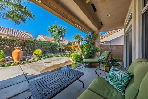 a outdoor living space with furniture and garden view