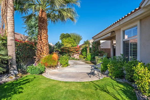 a view of a backyard of the house