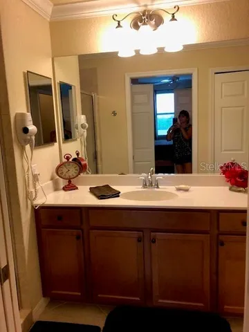 a bathroom with a sink and a mirror