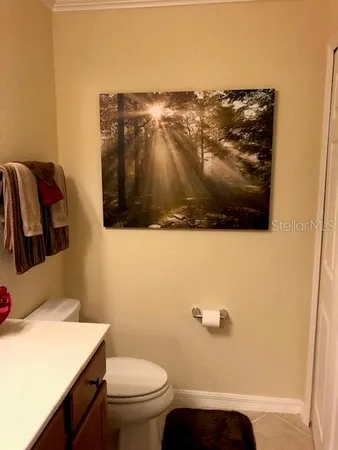 a bedroom with a bed and a lamp