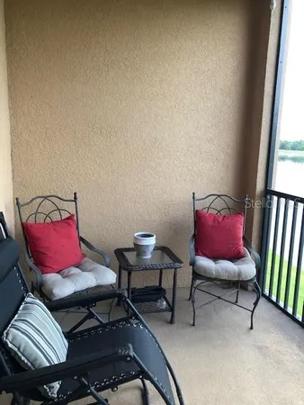 a view of hall way with furniture