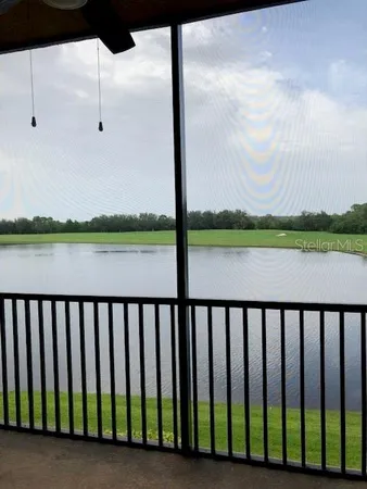 a front view of multiple houses with yard and green space