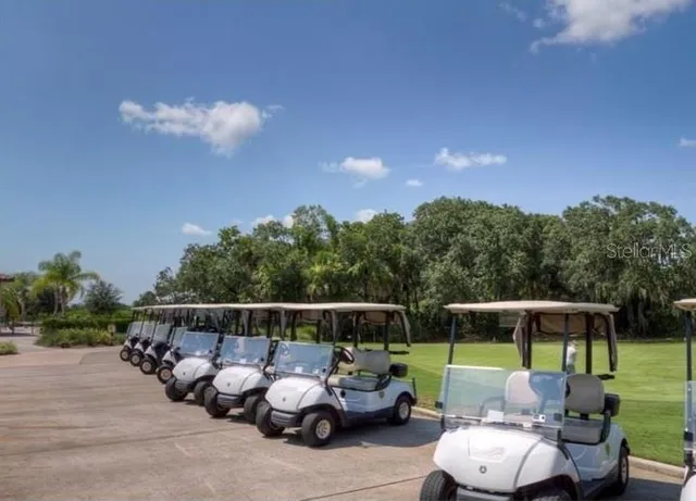 a room with pool table and windows