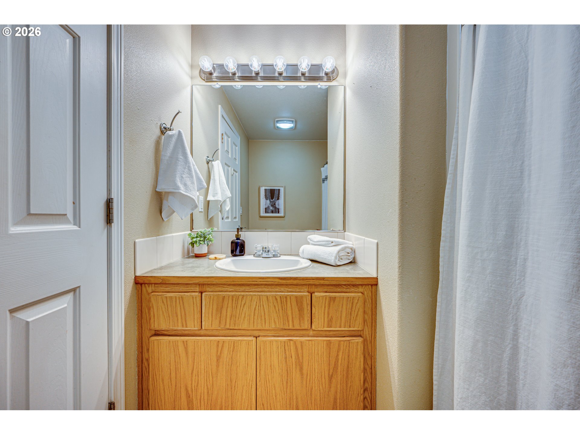 220 Mable Lane Woodland, WA 98674 - Photo 18 of 31 a bathroom with a sink and mirror