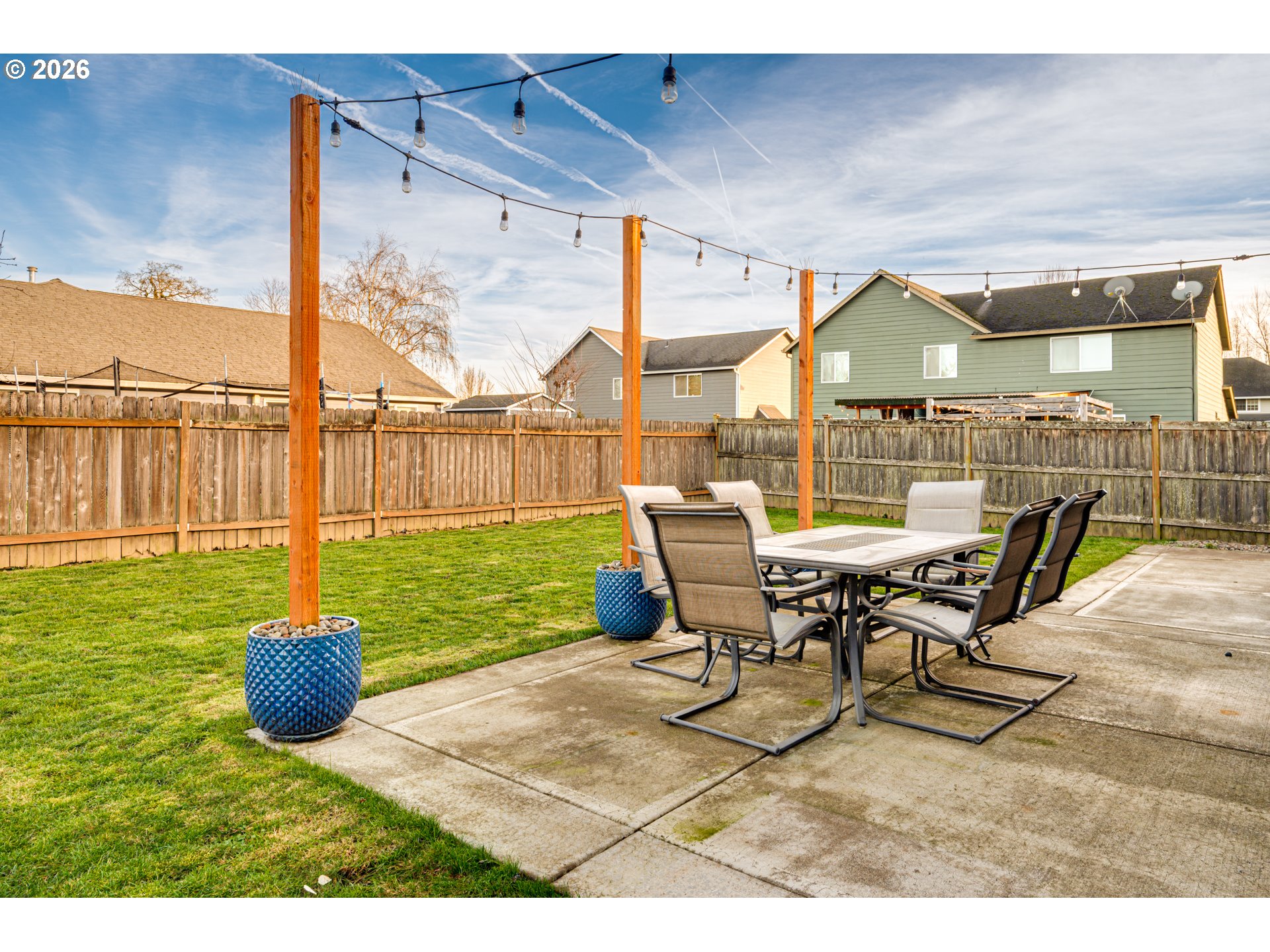220 Mable Lane Woodland, WA 98674 - Photo 27 of 31 a view of a patio with a table chairs and a yard