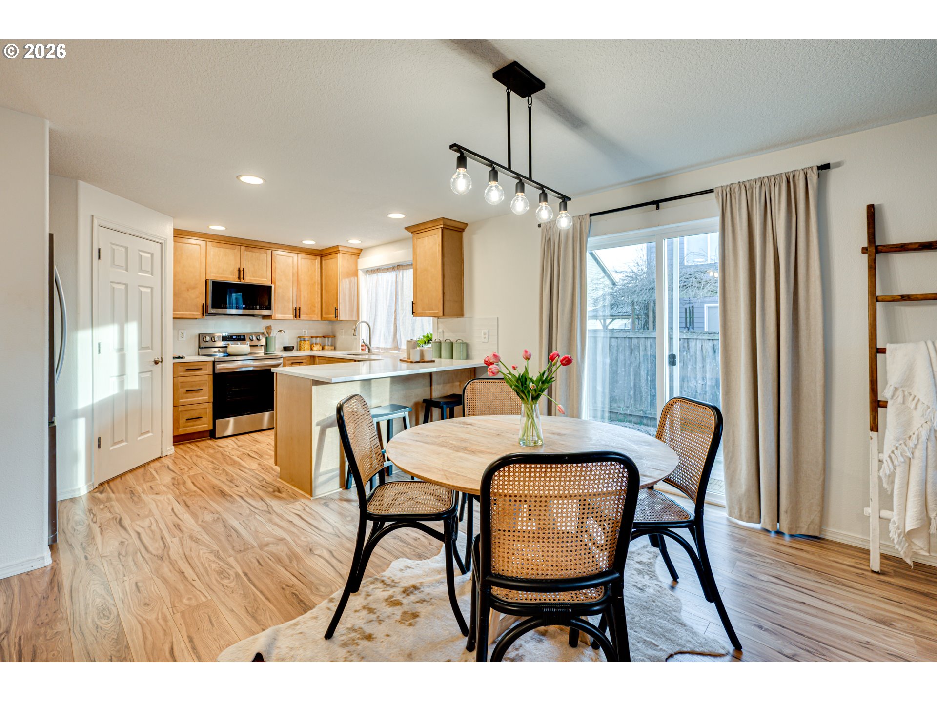 220 Mable Lane Woodland, WA 98674 - Photo 8 of 31 a view of a dining room with furniture window and wooden floor
