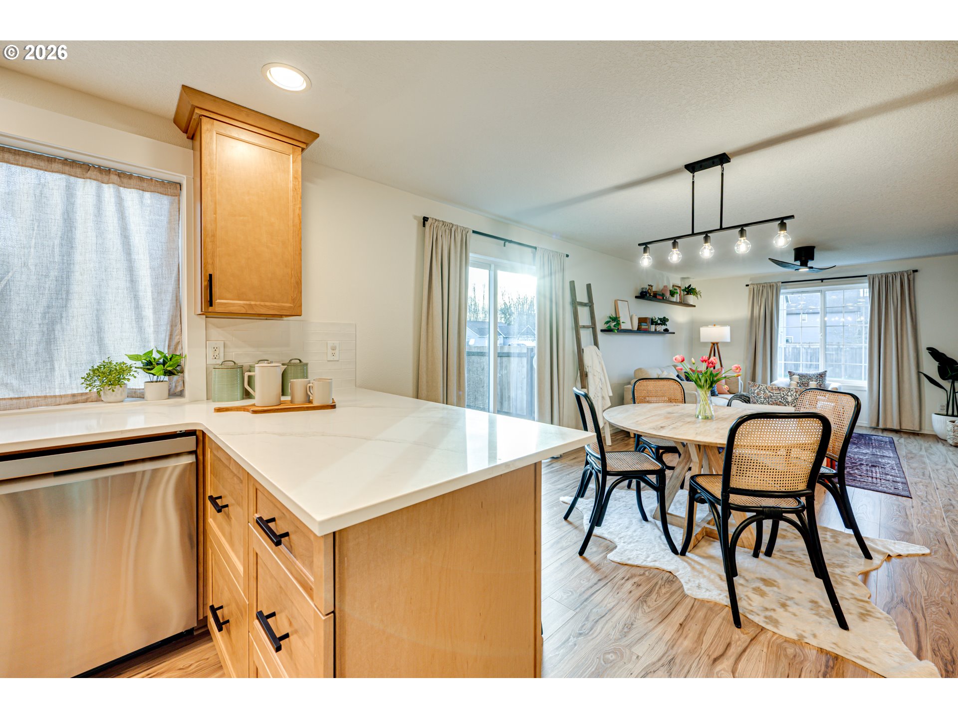 220 Mable Lane Woodland, WA 98674 - Photo 9 of 31 a kitchen that has a table chairs in it and wooden floors