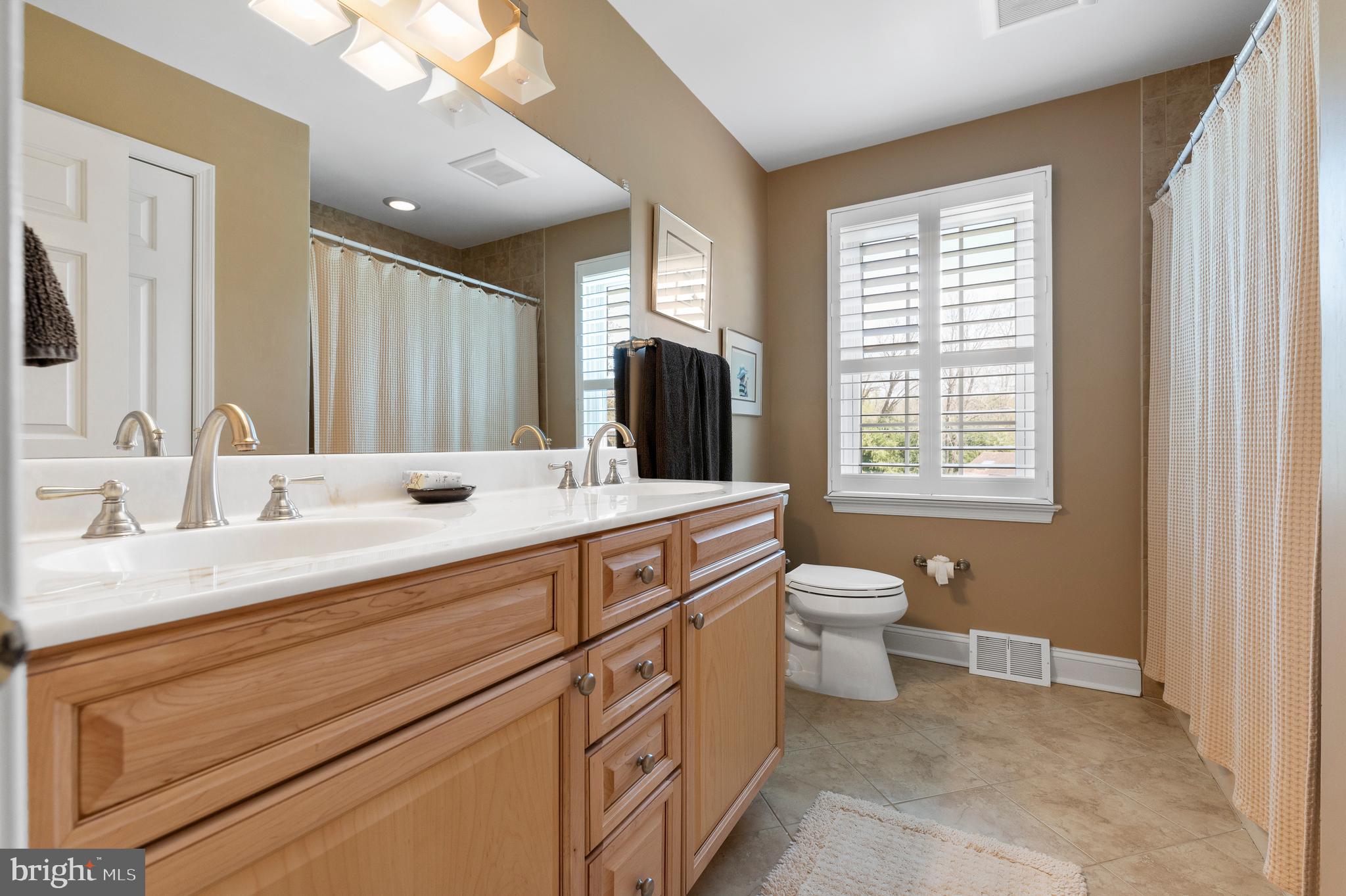 138 Davis Road Malvern, PA 19355 - Photo 66 of 96 Hall Bath w/ 2 sinks, tub, & linen closet