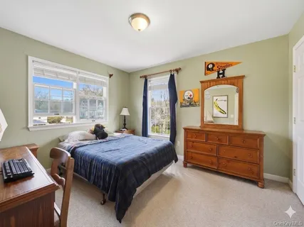 a bed room with a bed and a window