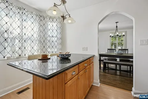 a kitchen with sink cabinets and window