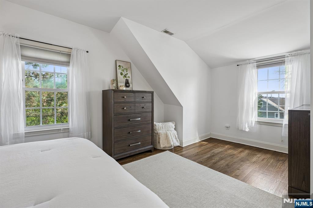 122 Johnson Avenue Mahwah, NJ 07430 - Photo 15 of 40 a bedroom with a bed and a window