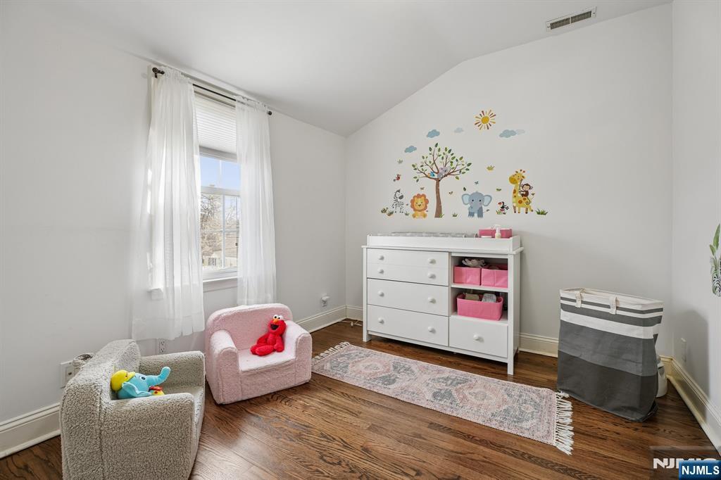122 Johnson Avenue Mahwah, NJ 07430 - Photo 18 of 40 a bedroom with furniture and wooden floor