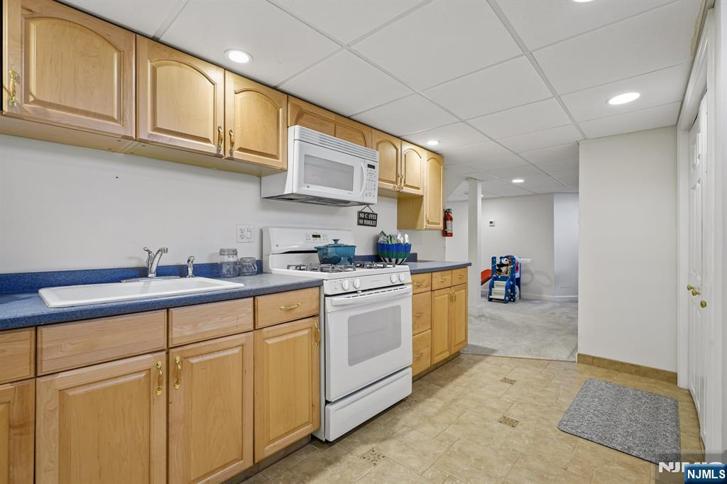 122 Johnson Avenue Mahwah, NJ 07430 - Photo 23 of 40 a kitchen with cabinets and a sink