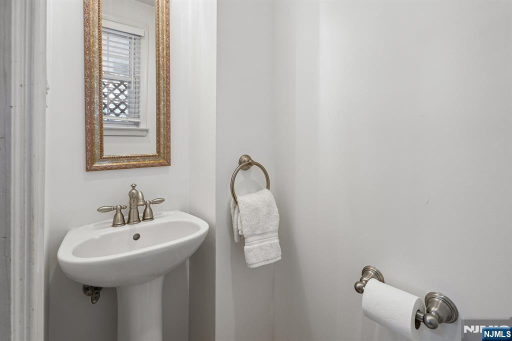 122 Johnson Avenue Mahwah, NJ 07430 - Photo 24 of 40 a bathroom with a sink and a mirror