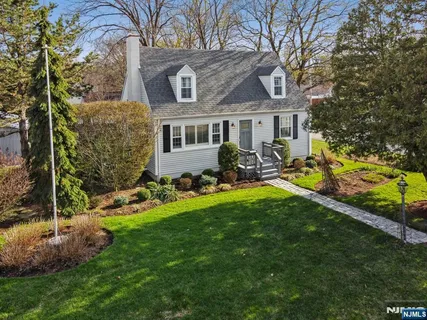 a aerial view of a house with a yard